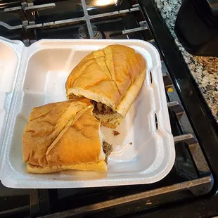 a sandwich in a styrofoam container