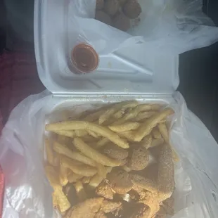 5 Chicken wings , crab bites, hush puppies, and fries.