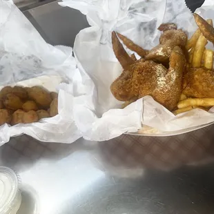 Fried Okra and 3 chicken wings topped with lemon pepper seasoning and fries