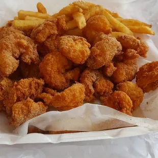 a basket of fried chicken and french fries