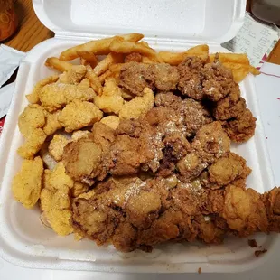 Fried catfish nuggets and gizzard with fries