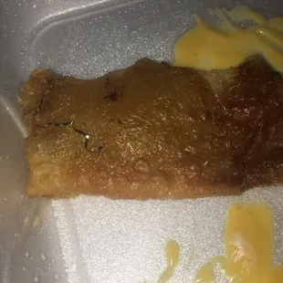 Piece of aluminum baked on my pizza puff