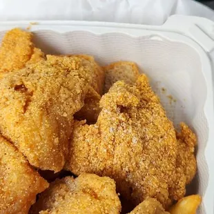 a basket of fried chicken and french fries