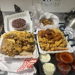 Overcooked oysters red beans and rice fried okra (delicious) Burnt prawns and calmari