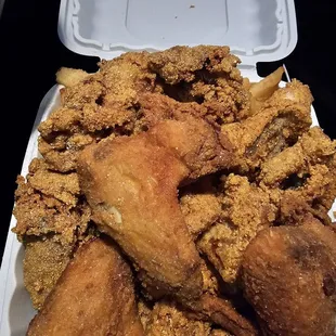 Combo plate, chicken wings, fried oysters, and catfish nuggets.