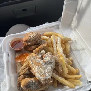 Four piece wing combo with fries and coleslaw.