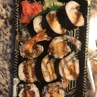 a plate of sushi and shrimp
