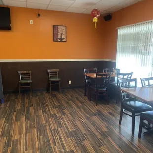 a restaurant with tables and chairs