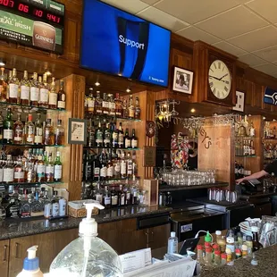 a bar with a large screen tv