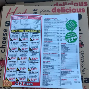 a pizza box with a menu on it