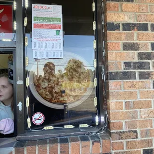a little girl looking out of a window