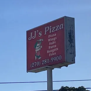 a sign for jj's pizza