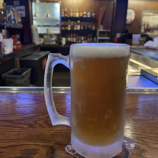 a mug of beer on a bar