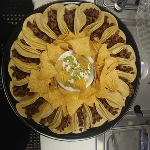 a plate of tacos and chips