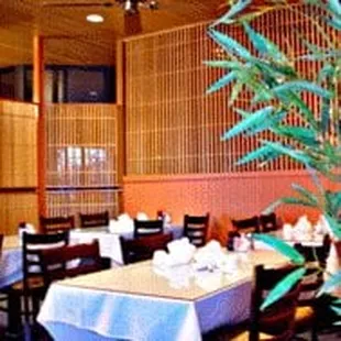 a dining room with tables and chairs