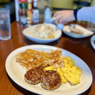 Delicious breakfast plate of sausage, scrambled eggs, and extra crispy hash browns for 9.99 until 11 am.
