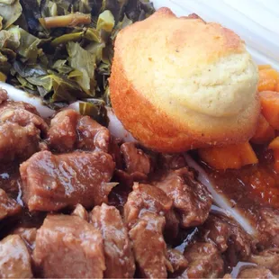 Beef tips over rice, turnip greens, yams and corn muffin, iced tea included, on the cheap.