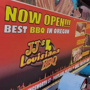 a woman standing in front of a sign