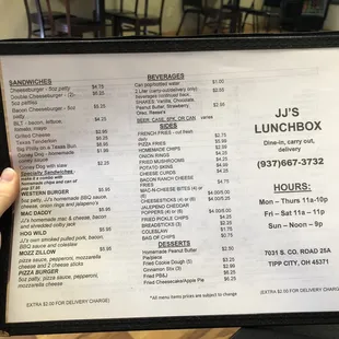 a person holding a menu