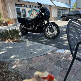 a hand holding a sandwich