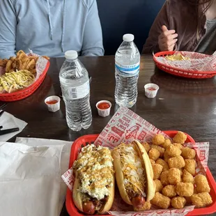 Top left: Polish polka &amp; onion rings. Bottom left: Southern girl. Bottom middle dawg: coney. Tots on the far right.