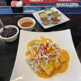 Blue crab enchilada with cream sauce, black beans and house salsa.