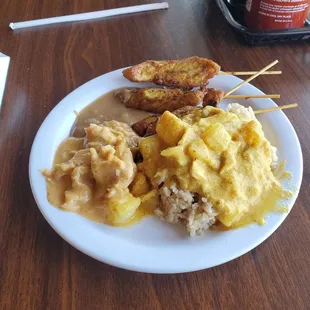 Chicken curry, panang curry, fried rice and chicken satay with peanut sauce.