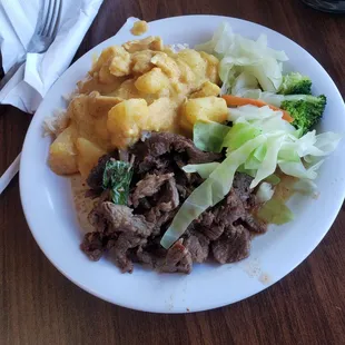 Yellow curry, basil beef and steamed vegetables.