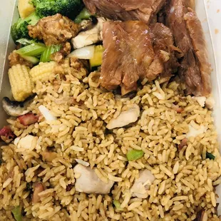 lunch combo #15 house fried rice, pork ribs and canton chicken.