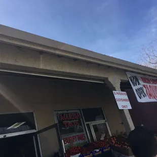 a man standing in front of a store