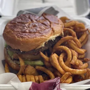 BBQ burger (bbq sauce, bacon, cheddar cheese, onion ring, avocado slices, lettuce, tomato) with curly fries