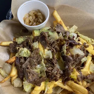 Philly cheesesteak fries. Grilled onions on the side. A miss.