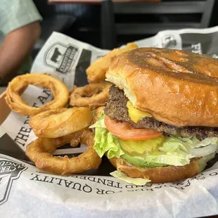 Classic burger with the fresh bread and beer batter onion rings.