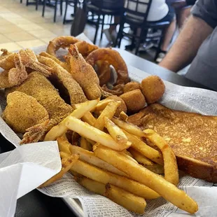 Fried fish, shrimp, fries, onion rings and hush puppies