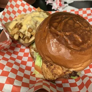 Burger with beef patty and grilled chicken, chili cheese fries