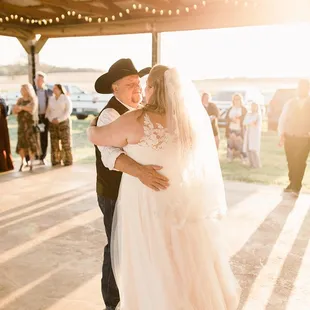 I love this sun kissed shot of the father-daughter dance!