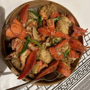 a bowl of lobster and rice