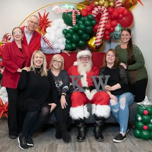 Cookie Party for our clients 2023... AND Santa stopped by to pose with some of out JMA Team!