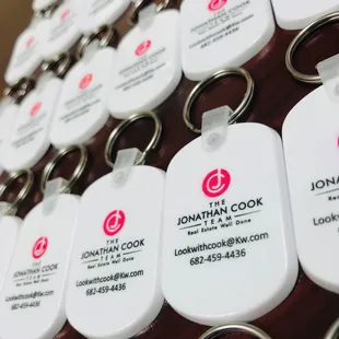 a closeup of the name tags on the keychains