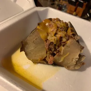 a closeup of a piece of food in a styrofoam container