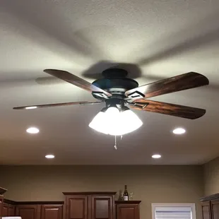 LED Can lighting with a dinning fan to keep it cool.