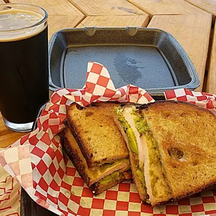 Smoked turkey, bacon, guacamole sandwich with a Pecan Porter pint