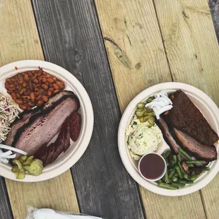 Brisket, ribs, sausage, pinto beans, green beans, potato salad, coleslaw, pickles and onions, and bbq sauce.