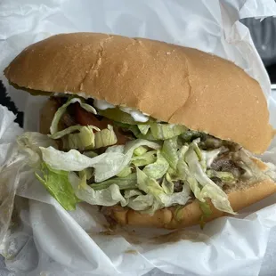Half a roast beef poboy fully dressed