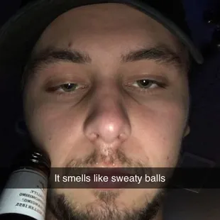 a man with a bottle of beer