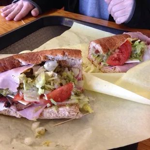 The regular bomber. Ham, turkey, pastrami, Swiss and American cheese.