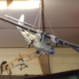 a model of a plane hanging from the ceiling