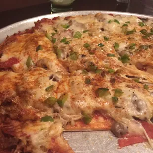 a pizza with cheese and pepperoni