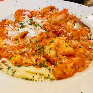 a plate of pasta and shrimp