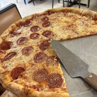 Half pepperoni half cheese ! banging as ever! waiter was super awesome.